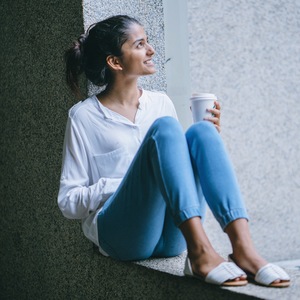 Girl looking up and smiling because of God's grace