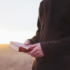 Man Holding a Bible
